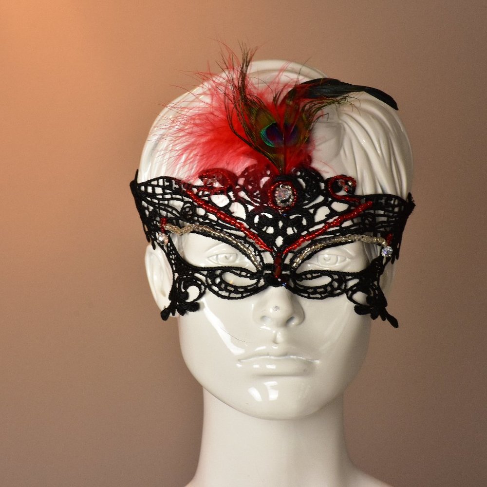 Hand beaded masquerade mask with feather accent